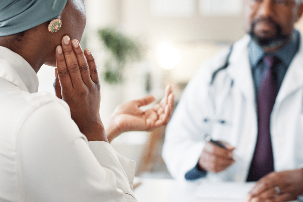 Woman seeking TMJ chiropractic treatment